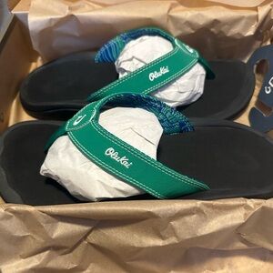 OluKai Teal Green and Black Strap Flip Flops